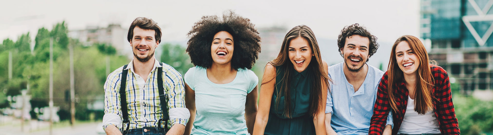 men and women smiling outside